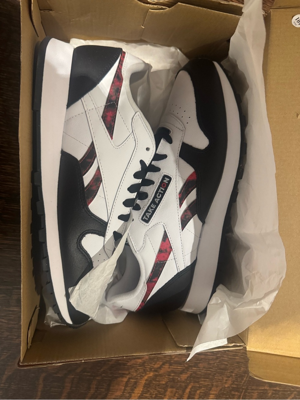 Reebok Men's White Black Sneakers with Red Marble Accents